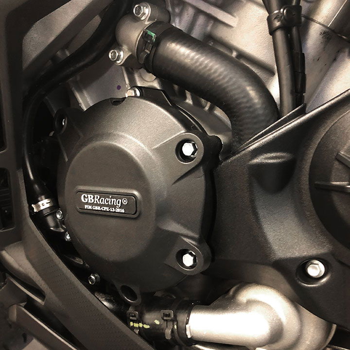 Close-up of a motorcycle engine with 'GBRacing engine protection.